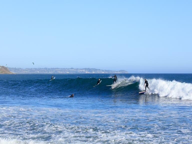 Surfers at Leo Carrillo State Beach in Malibu