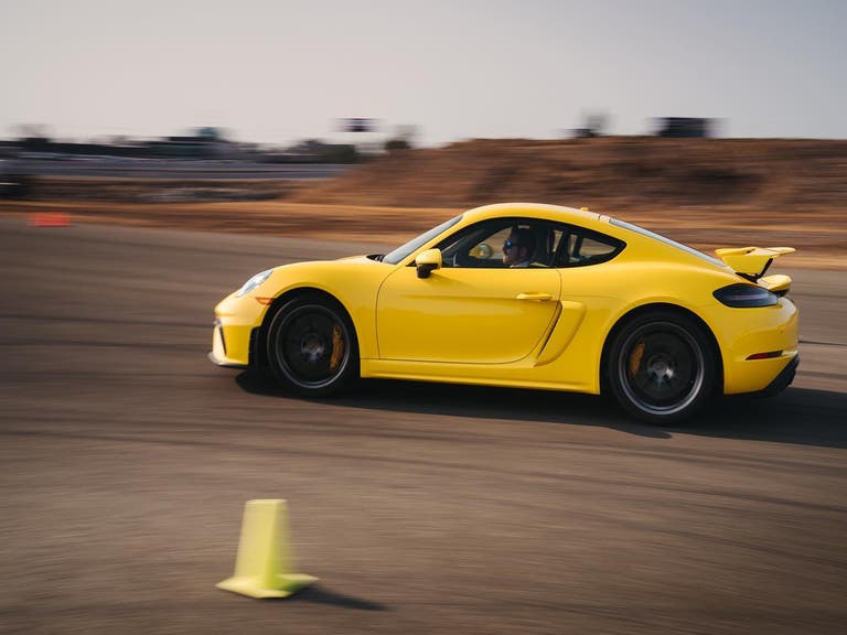 Yellow Porsche on the track at Porsche Experience Center Los Angeles